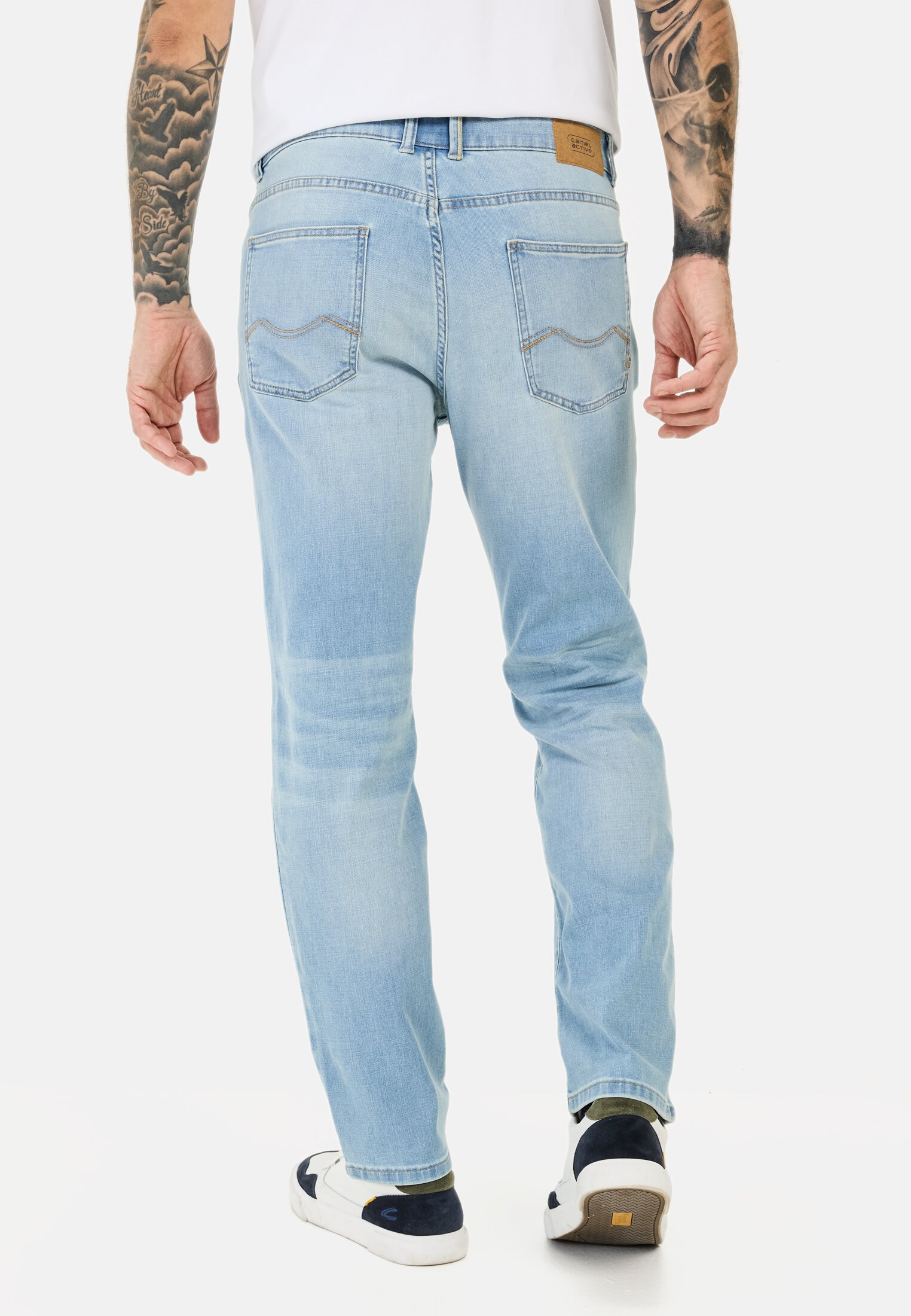 Men fleXXXactive® denim in relaxed fit Blue worn back